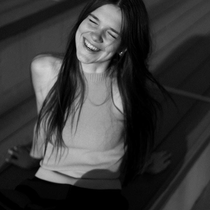 Kaveri Mehta, Lead Design Curator at Faint Portal Note, reviewing corporate floral arrangements